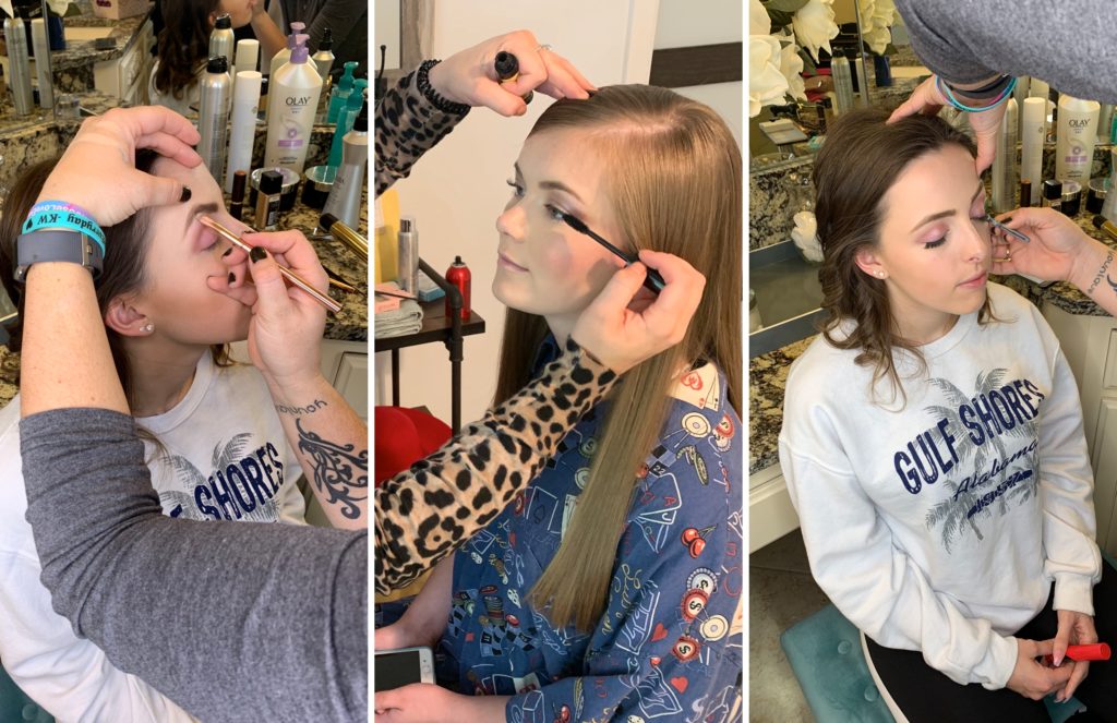High school senior girl getting her hair and makeup done by a professional for her senior pictures.