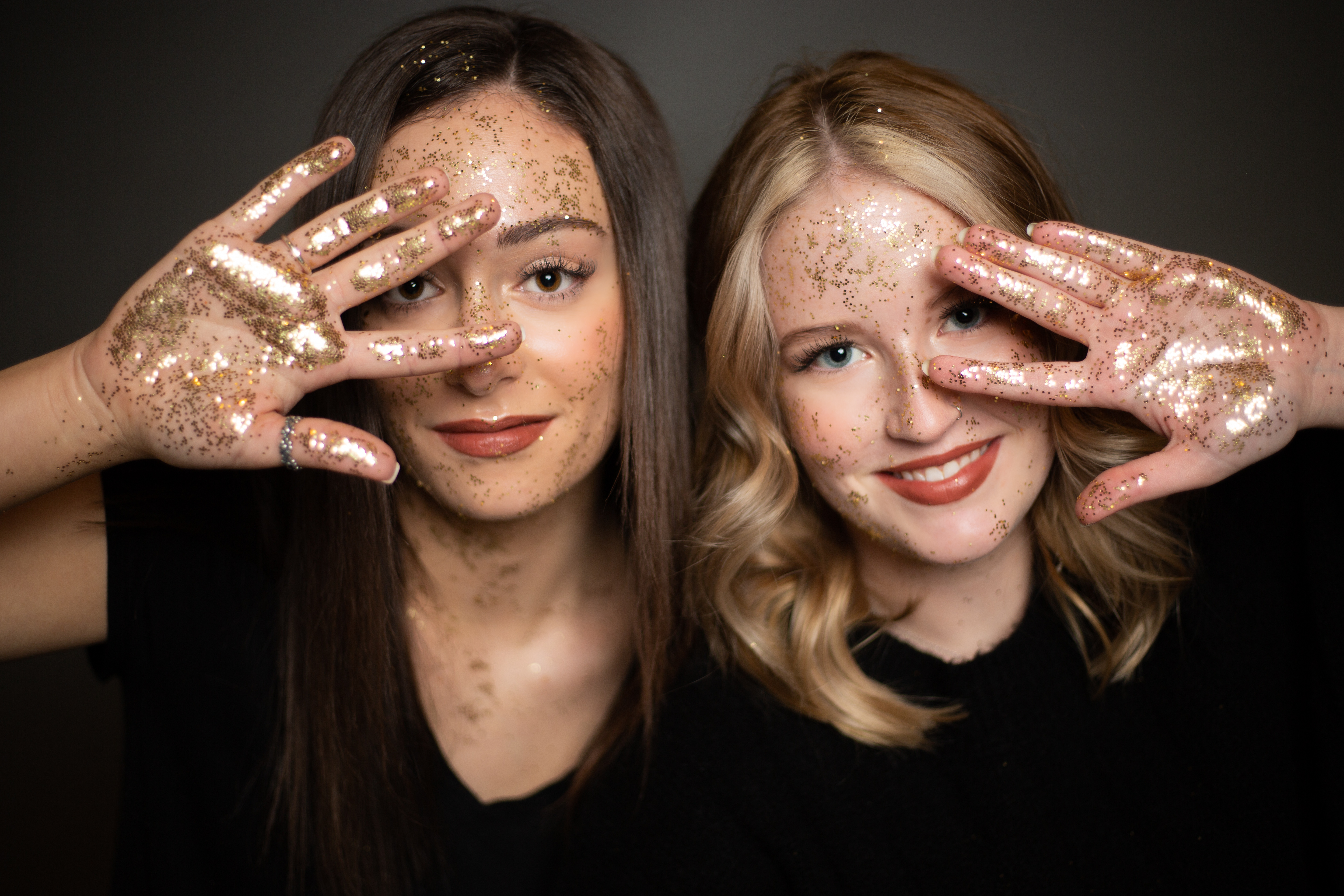 2 senior girls styled for a glitter photo shoot